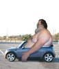 fat guy in a little car